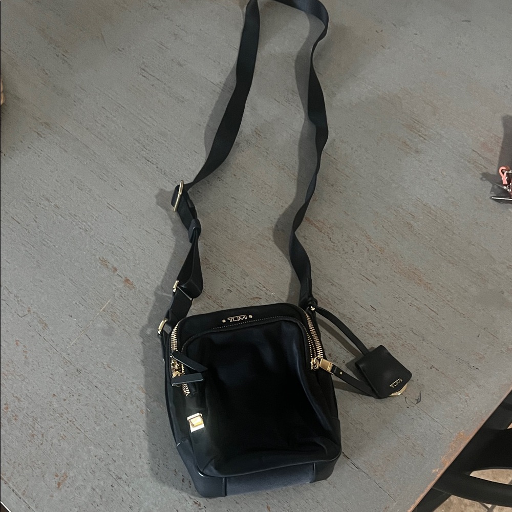 Tumi Black Messenger Bag with Gold Accents